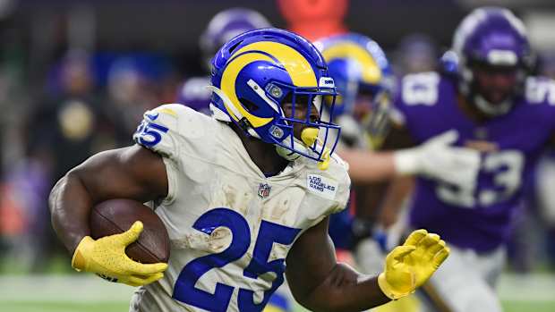 Dec 26, 2021; Minneapolis, Minnesota, USA; Los Angeles Rams running back Sony Michel (25) runs the ball against the Minnesota Vikings during the third quarter at U.S. Bank Stadium. Mandatory Credit: Jeffrey Becker-USA TODAY Sports